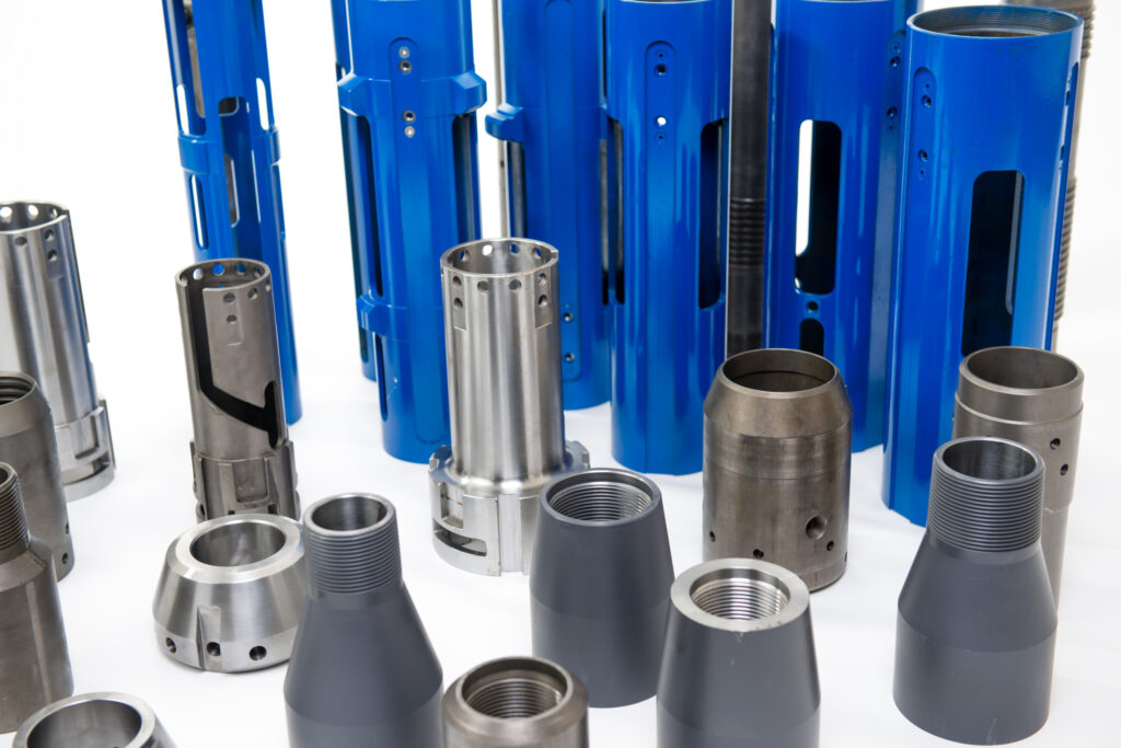 Various components used to assemble tubing anchor catchers