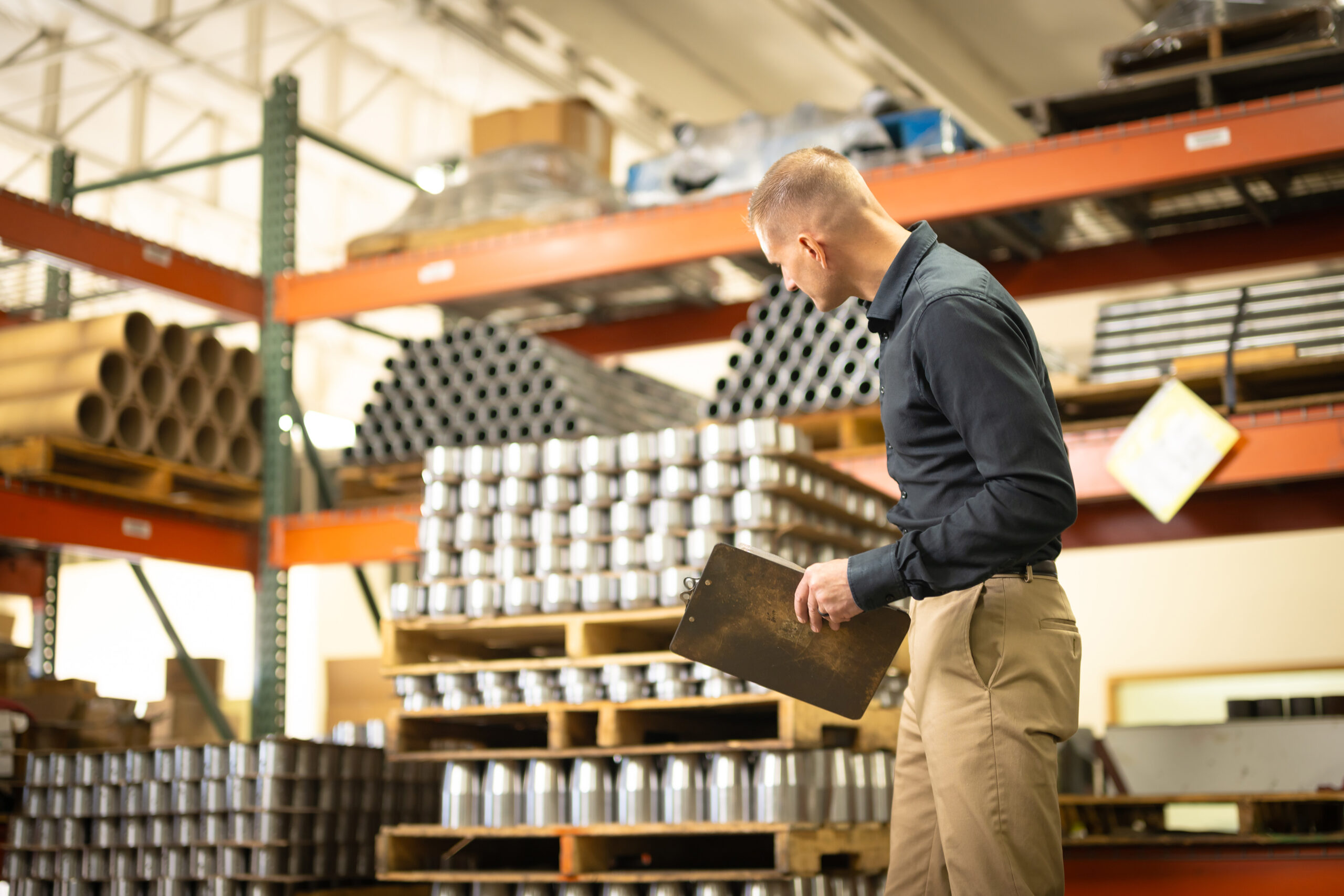 A man inspecting original manufacturer replacement parts for the TechTAC Slimline Tubing Anchor Catcher