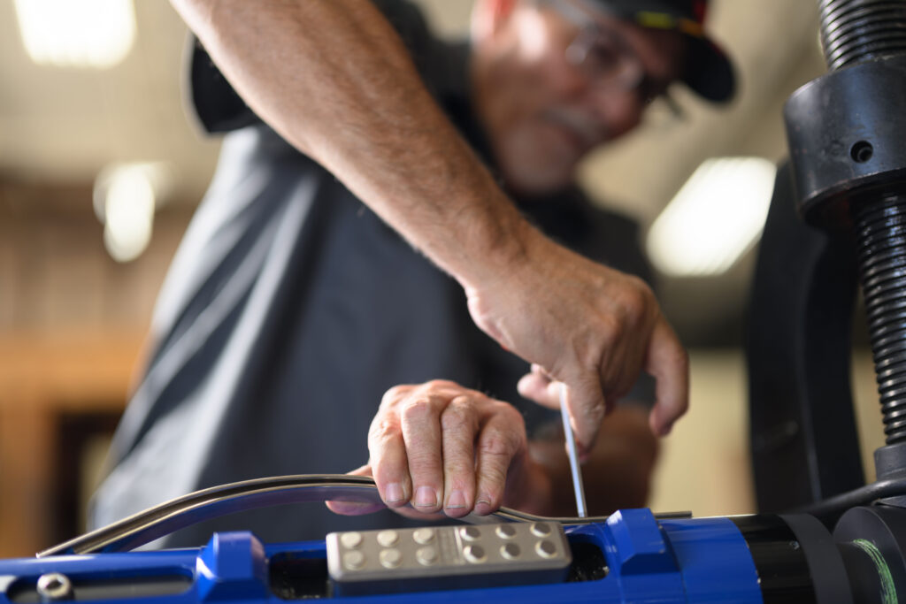 A TechTAC employee assembles a Slimline Tubing Anchor Catcher