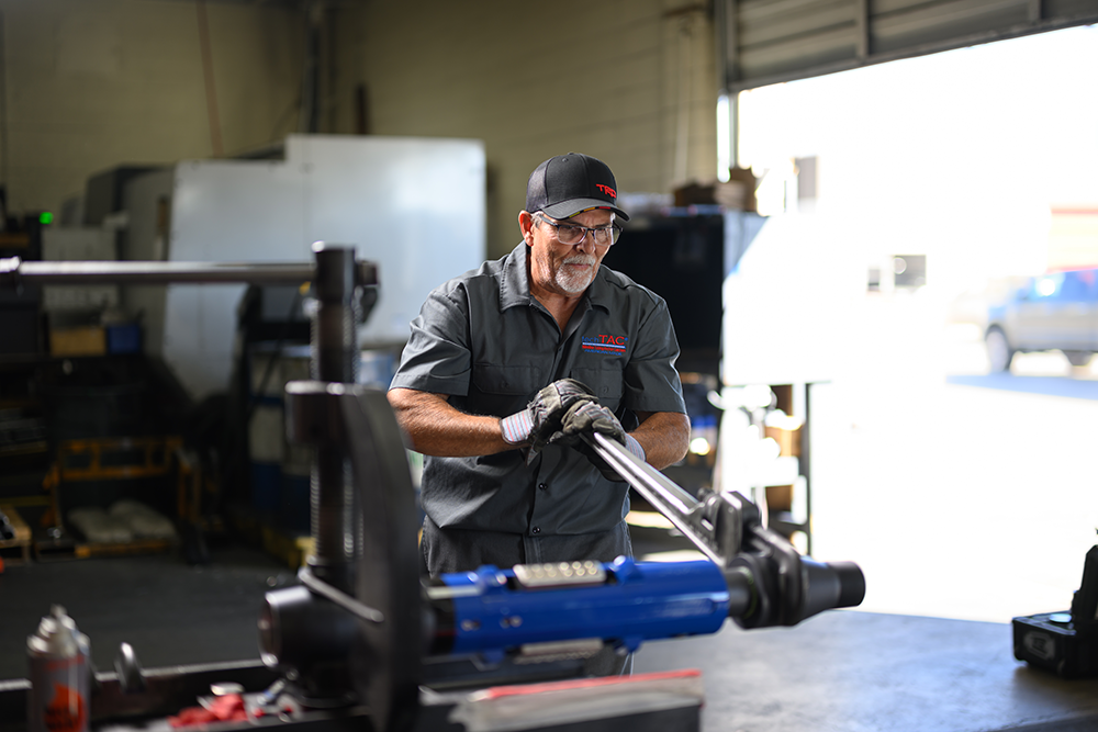 A TechTAC employee assembles a Slimline Tubing Anchor Catcher