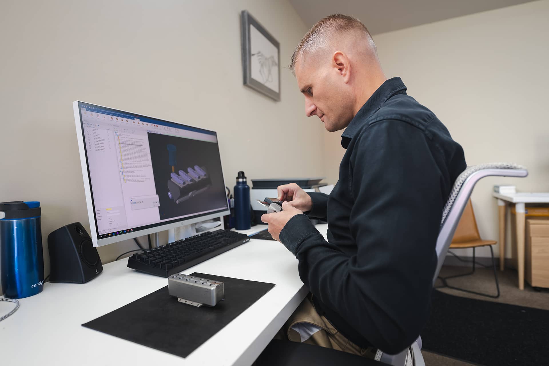 Engineer examining Slimline TAC parts