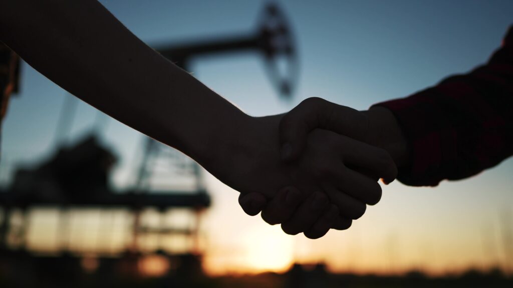 Shaking hands in the oil patch