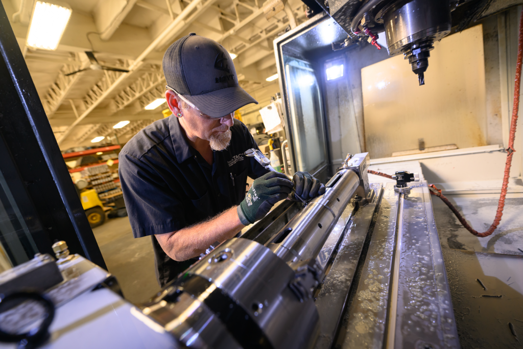 A TechTAC employee machines parts from the Slimline TAC, which is not just a specialty tool