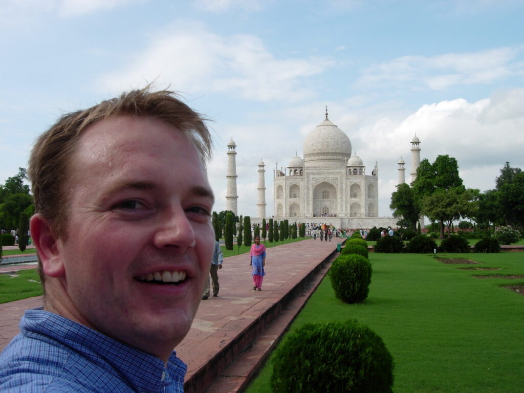 Brad Crist taking a selfie with the Taj Mahal
