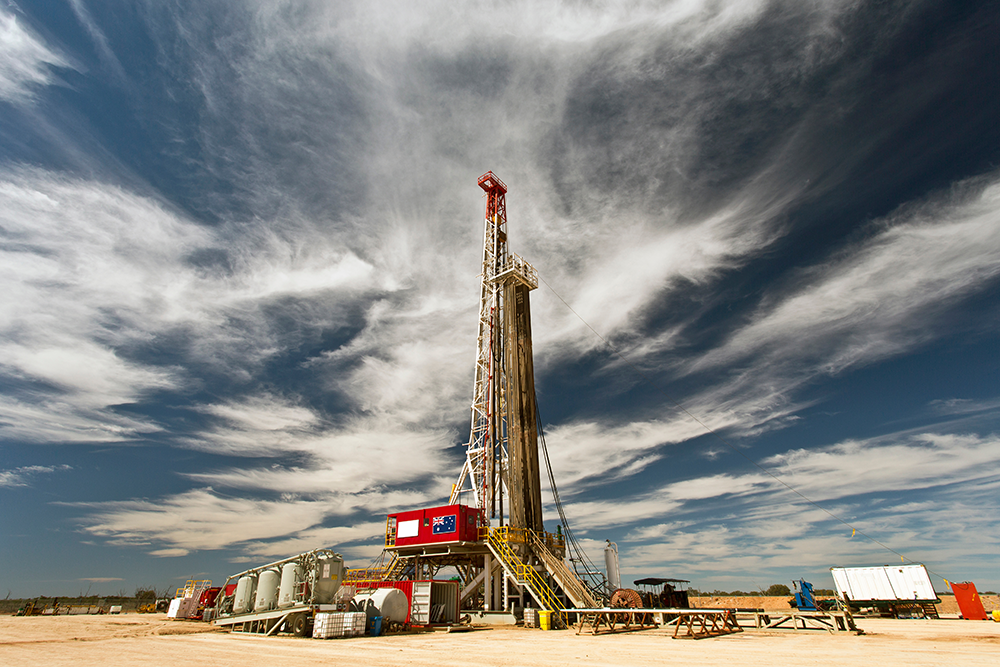 A land drilling rig against a cloudy sky