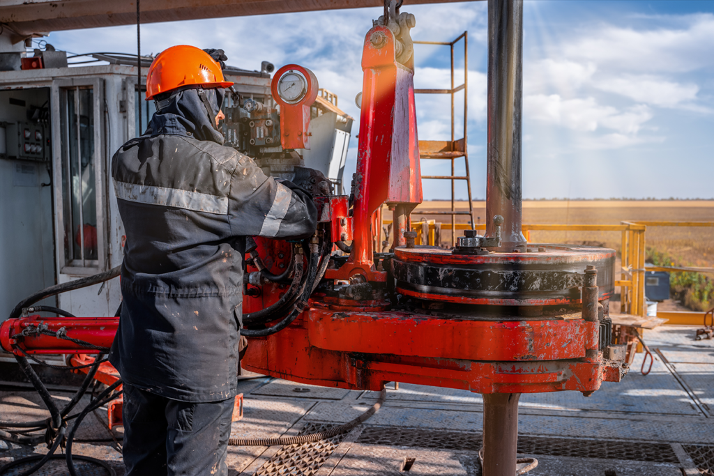 A rig crew worker at a well site
