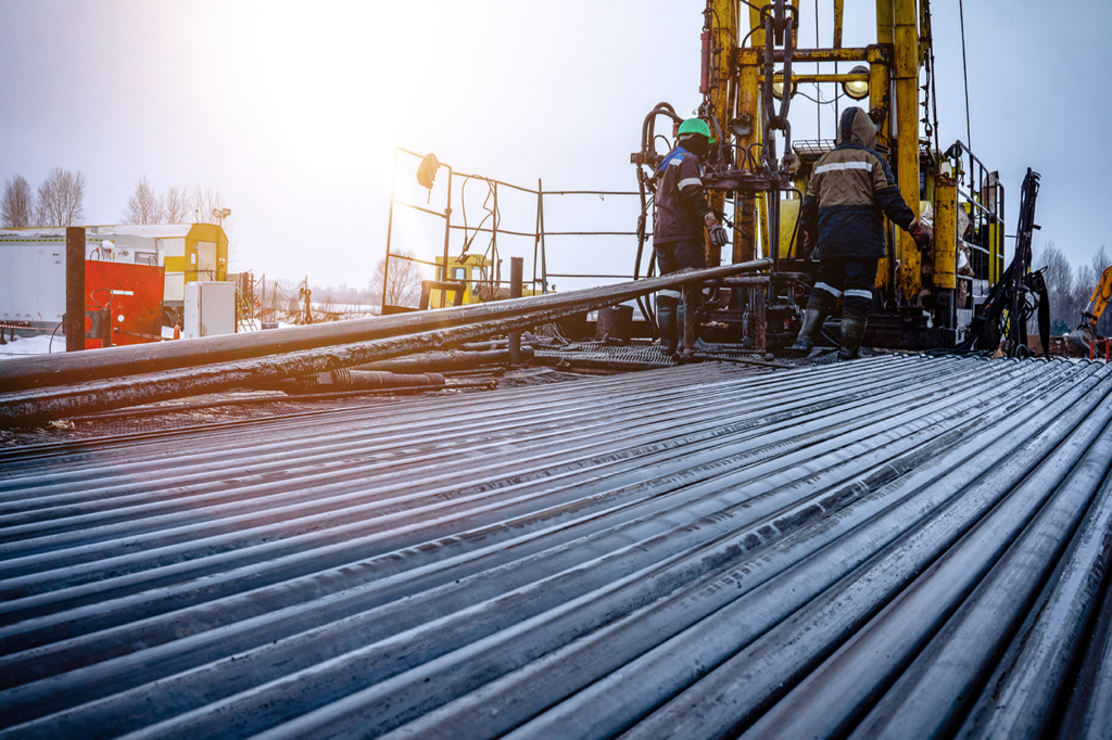 Dozens of sections of oil well tubing