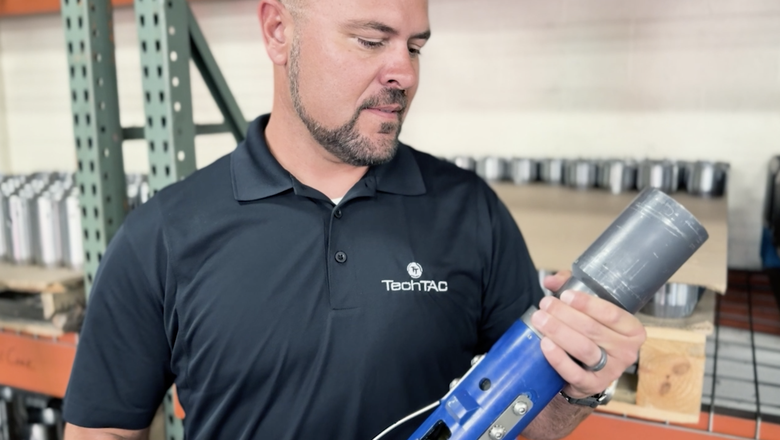 A TechTAC employee examines a Slimline TAC